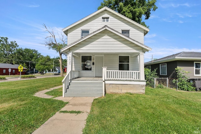 bungalow-style home with a porch and a front lawn