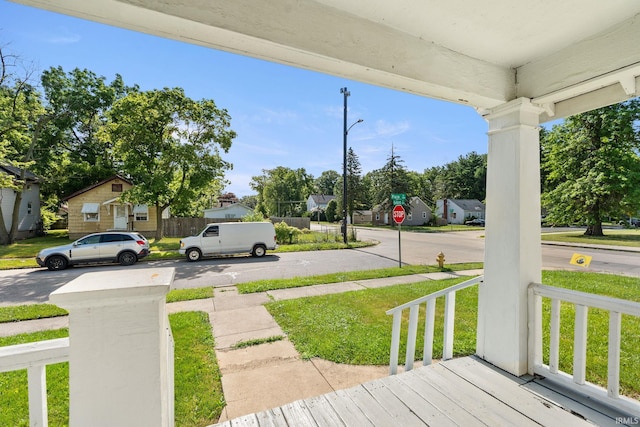 view of yard featuring covered porch