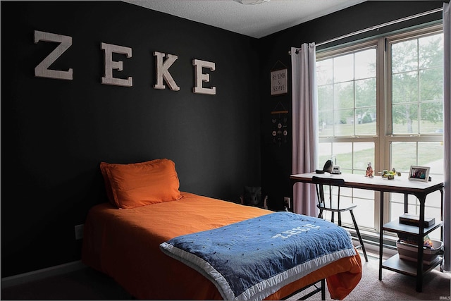 carpeted bedroom with a textured ceiling