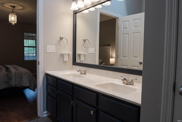 bathroom featuring hardwood / wood-style floors and vanity