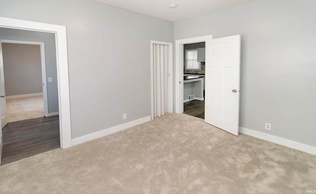 unfurnished bedroom featuring carpet flooring