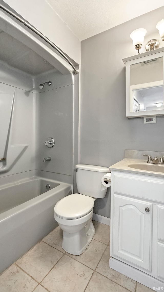 full bathroom with bathing tub / shower combination, tile patterned flooring, vanity, and toilet