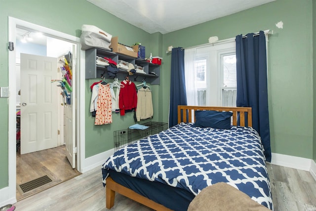 bedroom featuring hardwood / wood-style flooring