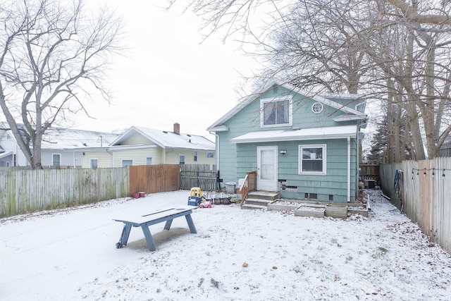 view of snow covered house