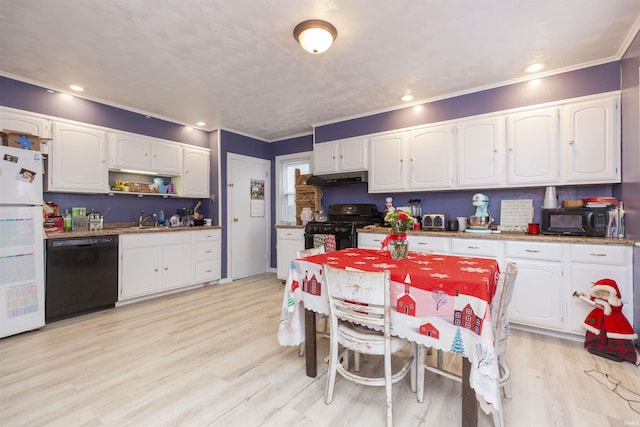 kitchen with sink, light wood-type flooring, white cabinets, black appliances, and ornamental molding