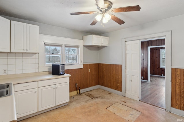 kitchen with white cabinets and ceiling fan