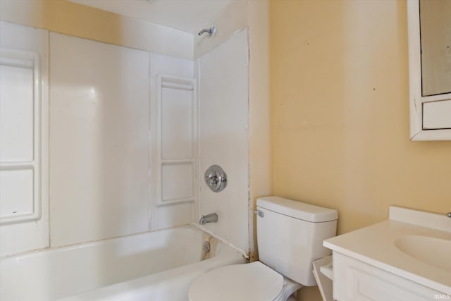 full bathroom featuring washtub / shower combination, vanity, and toilet