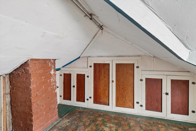 additional living space featuring vaulted ceiling