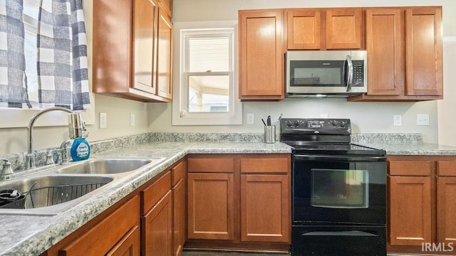 kitchen featuring electric range and sink