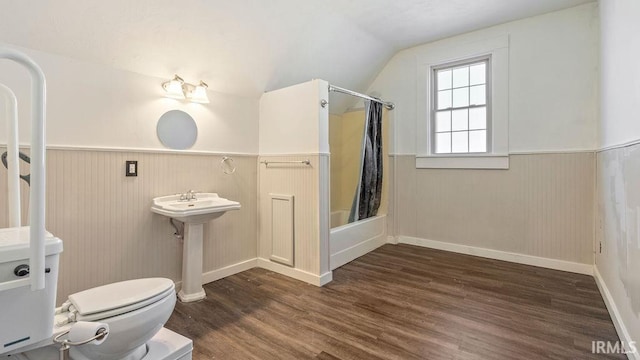 full bathroom featuring shower / bath combination with curtain, sink, hardwood / wood-style flooring, toilet, and lofted ceiling