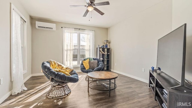 living area with dark hardwood / wood-style floors, a wall mounted AC, and ceiling fan