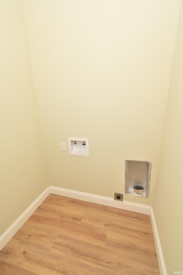 laundry area featuring hookup for a washing machine and hardwood / wood-style floors