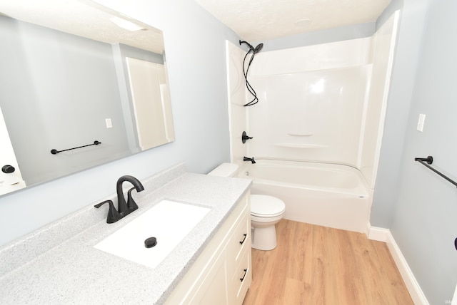 full bathroom with vanity, toilet, wood-type flooring, and shower / tub combination