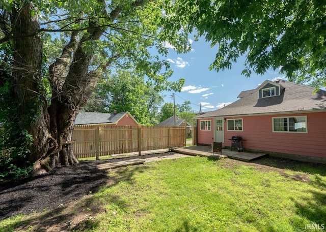 view of yard with a wooden deck