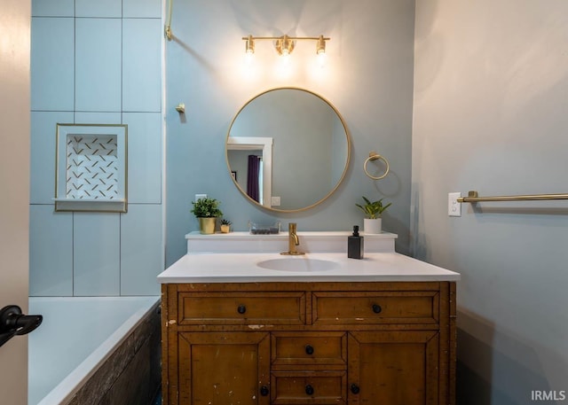 bathroom with a bath and vanity