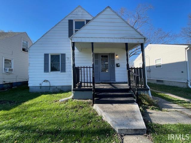 bungalow with a porch and a front yard