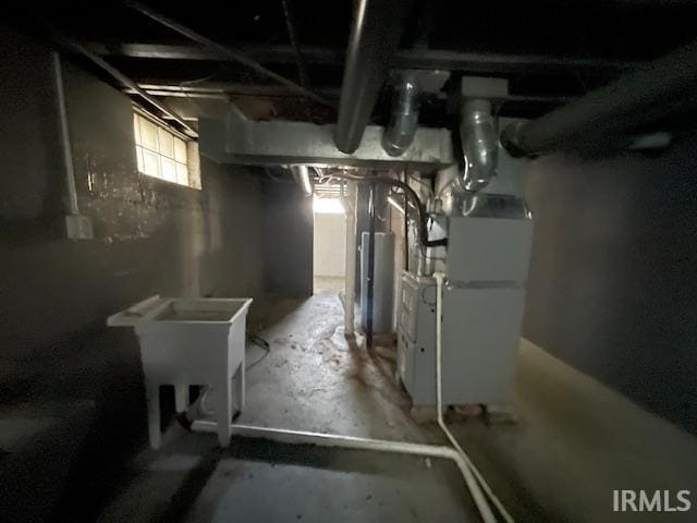 basement with heating unit and gas water heater