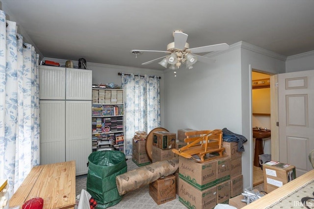 sitting room with ceiling fan and ornamental molding