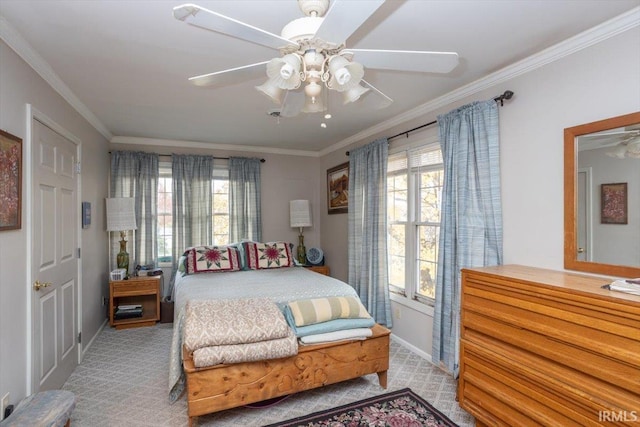 bedroom featuring multiple windows, ceiling fan, and crown molding