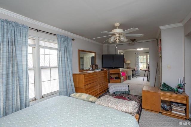 carpeted bedroom with ceiling fan and crown molding