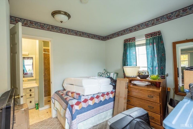 bedroom with light tile patterned floors