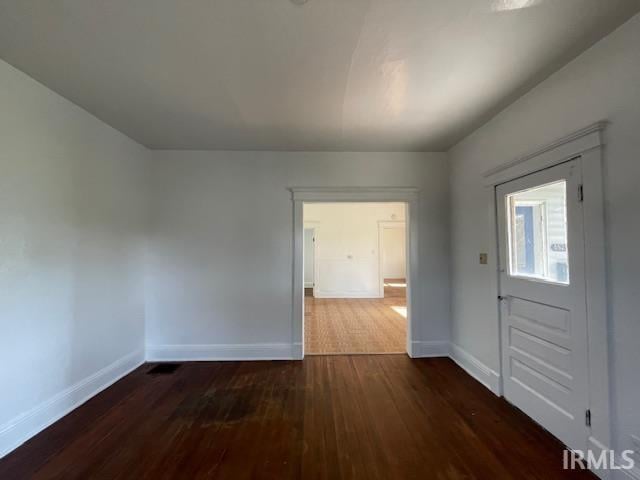 foyer entrance featuring dark hardwood / wood-style floors