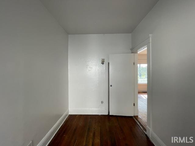 spare room featuring dark hardwood / wood-style floors