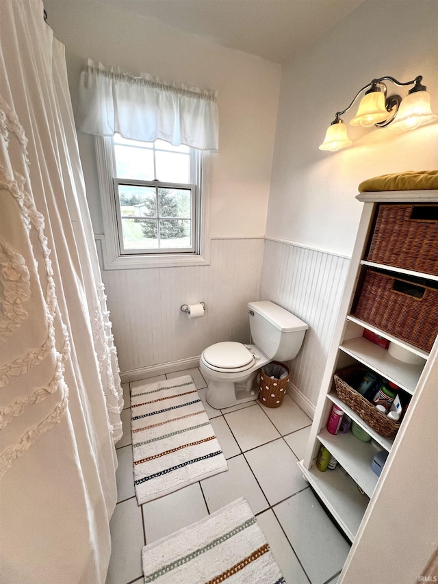 bathroom with tile patterned floors and toilet