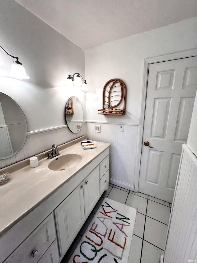 bathroom with tile patterned flooring and vanity