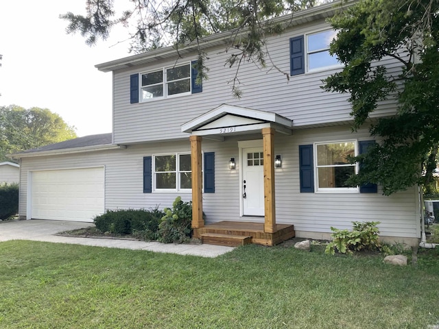 view of front facade featuring a garage and a front lawn