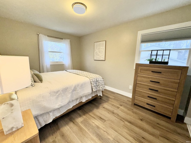 bedroom with wood-type flooring