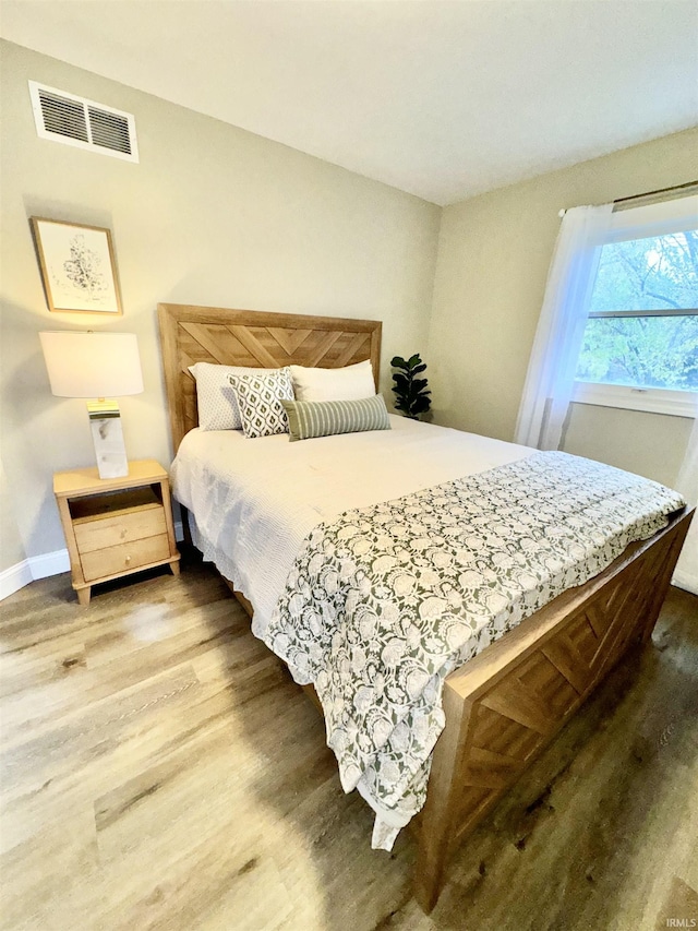 bedroom featuring wood-type flooring