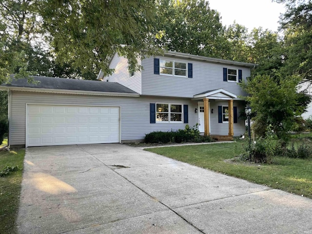 front of property featuring a garage and a front lawn