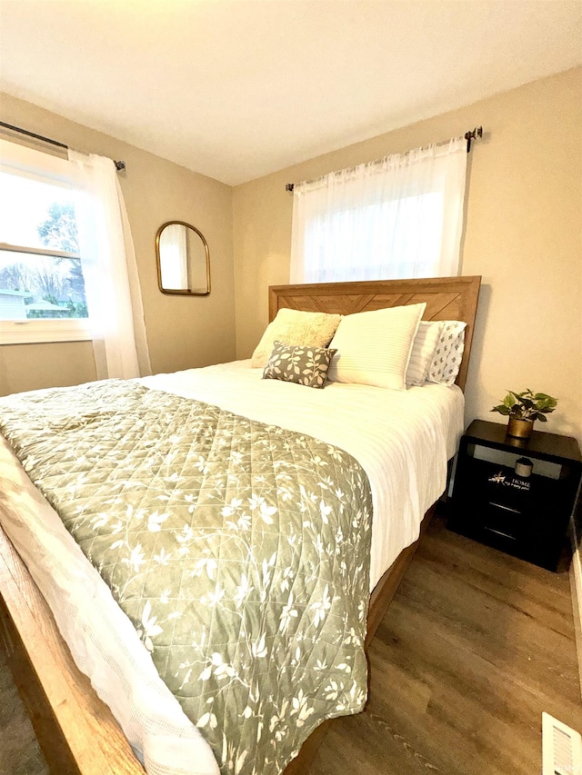 bedroom featuring dark hardwood / wood-style flooring