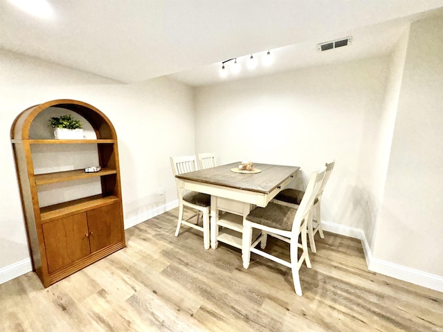 dining room with light hardwood / wood-style floors