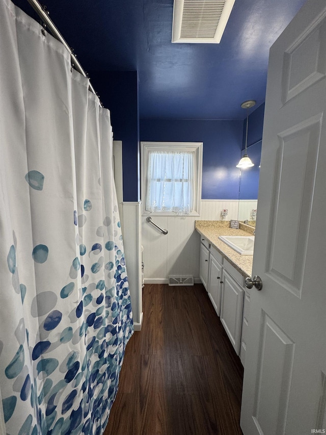 bathroom featuring vanity and hardwood / wood-style flooring