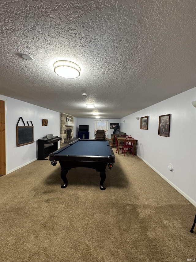 playroom featuring carpet floors, a textured ceiling, and pool table