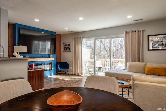 dining space featuring hardwood / wood-style flooring