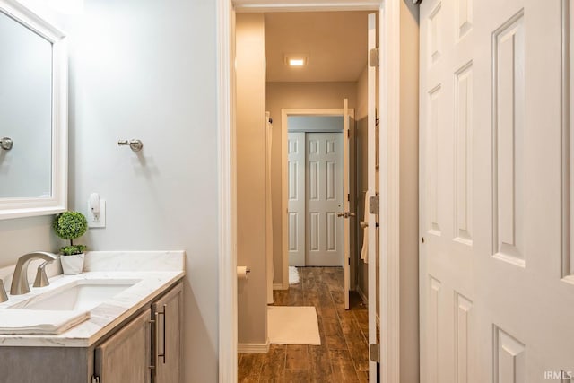 bathroom featuring hardwood / wood-style floors and vanity