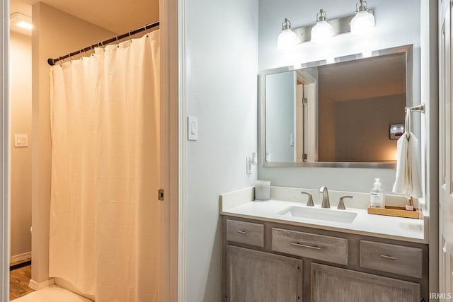 bathroom with vanity and a shower with shower curtain