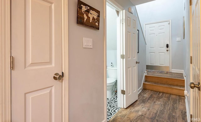 hallway with dark hardwood / wood-style flooring