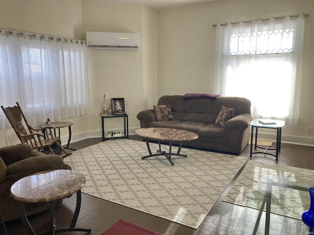 living room featuring a wall mounted air conditioner and hardwood / wood-style floors