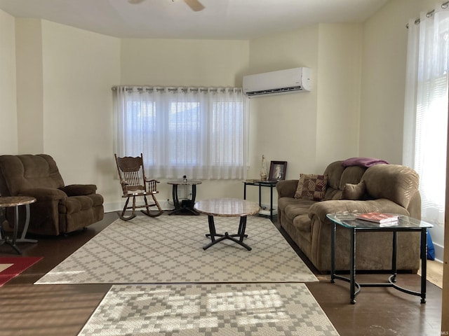 living room featuring ceiling fan and a wall mounted air conditioner