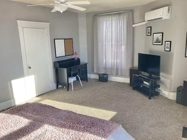 bedroom with ceiling fan, carpet, and a wall mounted air conditioner