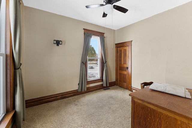 bedroom with light colored carpet and ceiling fan