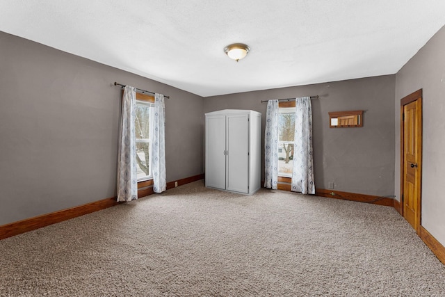 unfurnished bedroom with carpet flooring