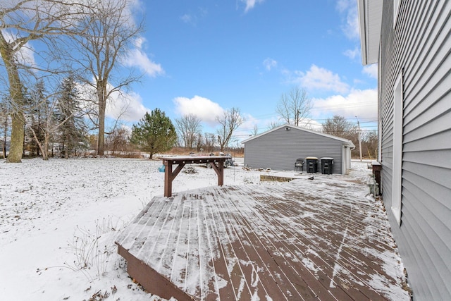 snow covered deck with an outbuilding