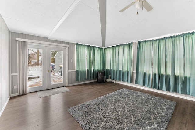 sunroom / solarium featuring ceiling fan and french doors