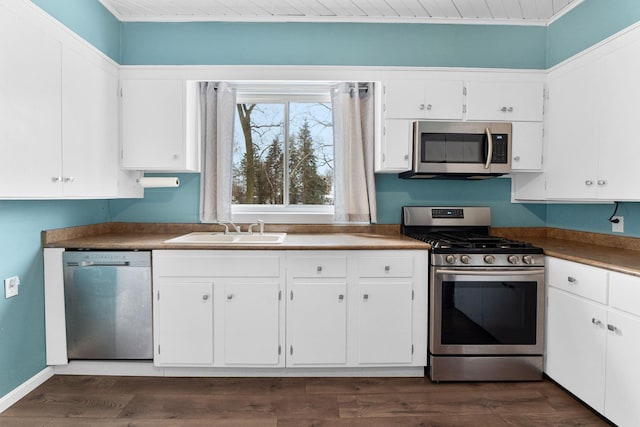 kitchen with sink, white cabinetry, and stainless steel appliances