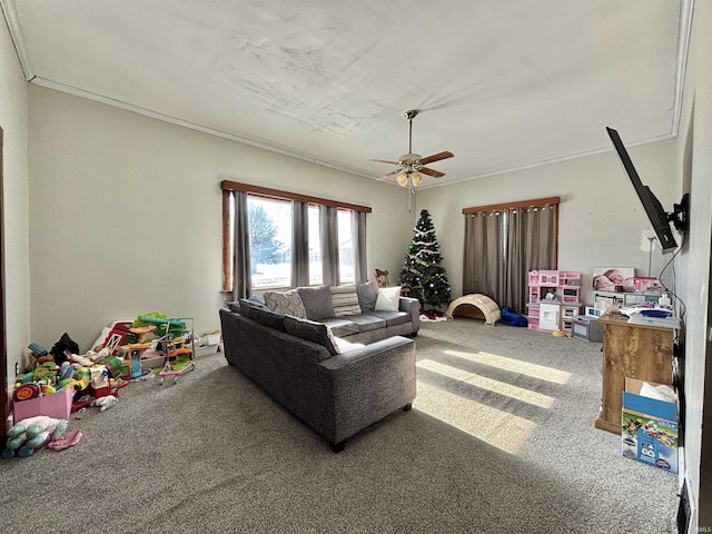 living room featuring carpet, ceiling fan, and crown molding